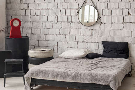 industrial style bedroom interior design. Black and white palette, white brick wallsの写真素材