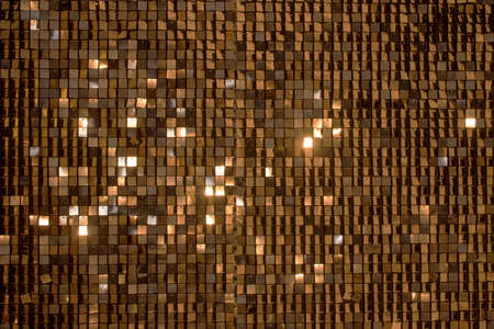 Beautiful abstract sparkles glitter background. Glittering sequins on the wallの写真素材
