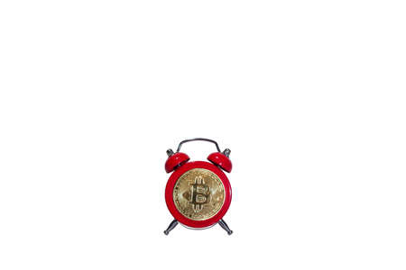 Bitcoin and alarm clock isolated on white background. Deadline concept for investing in bitcoin cryptocurrency.の写真素材