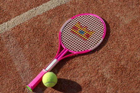Tennis game. Tennis ball with racket on the tennis court. The concept of sports, recreationの写真素材