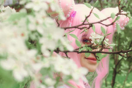 Portrait of young european woman wearing kimono. Asian beauty. Cherry blossoms. Hanami. Sightseeing...