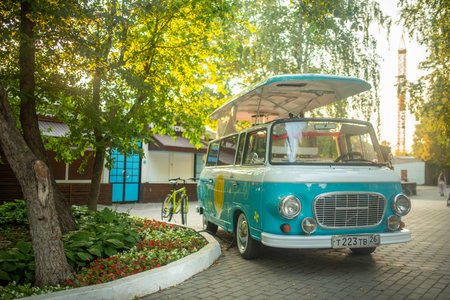 Mobile drink and snack van in a city park in summer sunny dayの写真素材