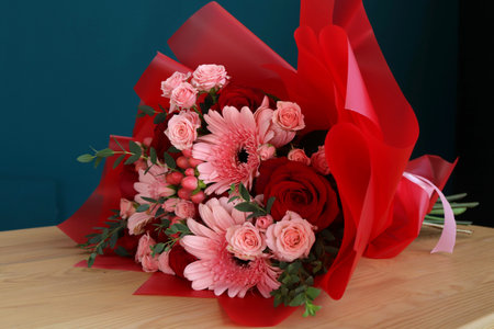 Beautiful flowers on table indoors. Space for textの写真素材