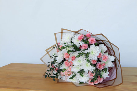 Beautiful flowers on table indoors. Space for textの写真素材