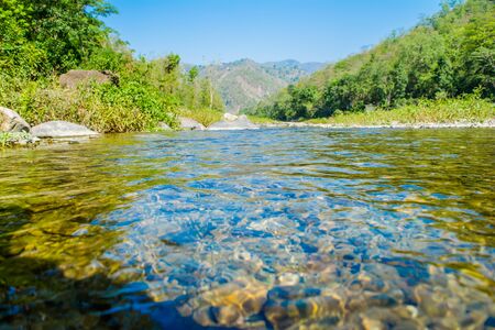 Stones under crystal clear water of  Ganga River at Rishikeshの写真素材