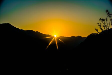 Sunrise behind the mountains of Rishikesh, Located in the foothills of the Himalayas in northern India,の写真素材