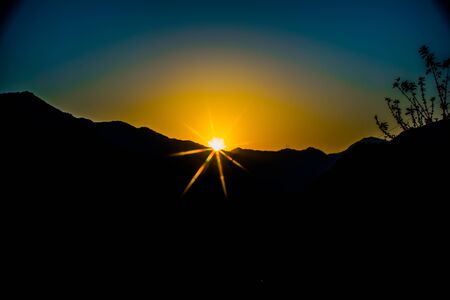 Sunrise behind the mountains of Rishikesh, Located in the foothills of the Himalayas in northern India,の写真素材