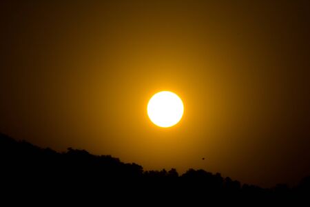 Sunrise behind the mountains of Rishikesh, Located in the foothills of the Himalayas in northern India,の写真素材