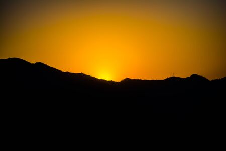 Sunrise behind the mountains of Rishikesh, Located in the foothills of the Himalayas in northern India,の写真素材