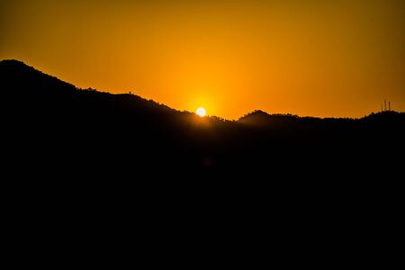 Sunrise behind the mountains of Rishikesh, Located in the foothills of the Himalayas in northern India,の写真素材
