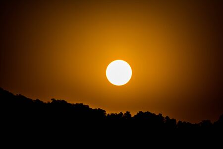 Sunrise behind the mountains of Rishikesh, Located in the foothills of the Himalayas in northern India,の写真素材
