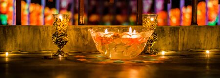 Happy Diwali - rangoli painting on floor for diwali with floating candlesの写真素材