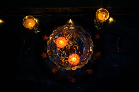 Happy Diwali - rangoli painting on floor for diwali with floating candlesの写真素材