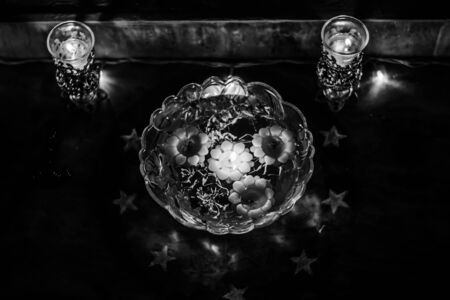 Happy Diwali - rangoli painting on floor for diwali with floating candlesの写真素材