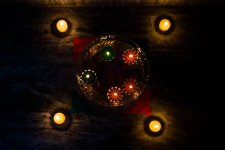 Happy Diwali - rangoli painting on floor for diwali with floating candlesの写真素材