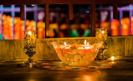 Happy Diwali - Colorful clay diya lamps lit during diwali celebrationの写真素材