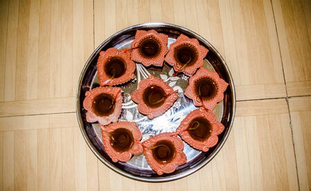 Happy Diwali - Colorful clay diya lamps lit during diwali celebrationの写真素材
