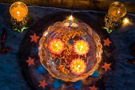 Happy Diwali - Colorful clay diya lamps lit during diwali celebrationの写真素材