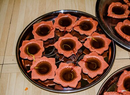 Happy Diwali - Colorful clay diya lamps lit during diwali celebrationの写真素材