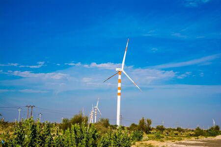Windmills in desert of  Jaisalmer the golden city, an ideal allure for travel enthusiasts, Sam Sand Dunesの写真素材