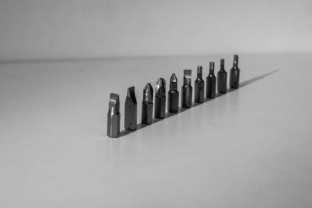 Different types of screw bits of screwdriver isolated on white background.の写真素材