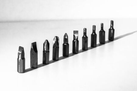 Different types of screw bits of screwdriver isolated on white background.の写真素材