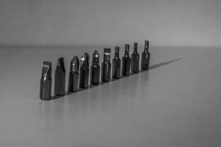 Different types of screw bits of screwdriver isolated on white background.