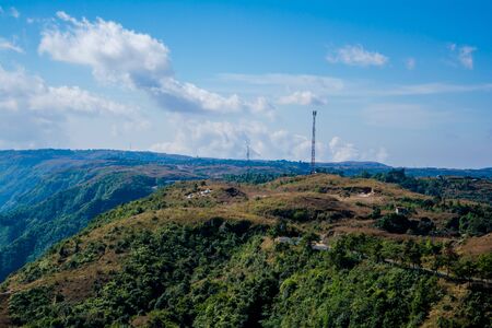 Natural view of the folded mountains and lush green valleys with clear sky and clouds of Cherrapunji, Meghalaya, North East Indiaの写真素材
