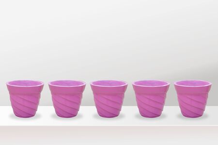 empty flower pots of different colour and different prospective, isolated on white background, copy space.の写真素材