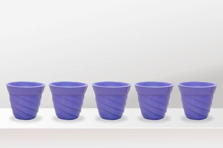 empty flower pots of different colour and different prospective, isolated on white background, copy space.の写真素材