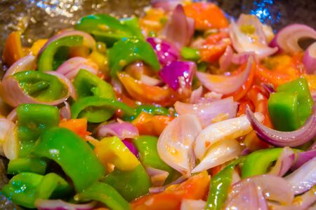 Stir fried colorful vegetables in a wok, Healthy food. Concept for a tasty and healthy vegetarian meal. Close upの写真素材