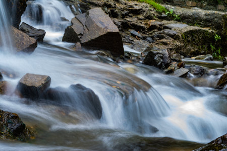 small waterfall with a small lake near Bhimtal. Landscape view of a small waterfall in the...