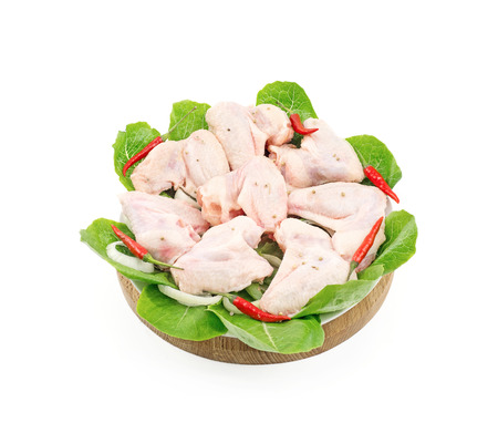 chilled chicken wings in a circle on wooden and white plate Studio isolationの写真素材