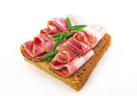 sandwich with bacon and black breadの写真素材