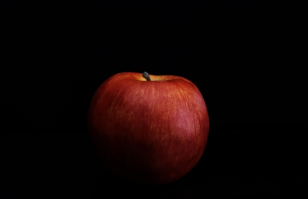 Isolated red apple on black の写真素材