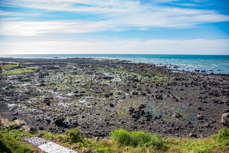 Ocean near the Yongduam Dragon Head Rock, Jeju Island, Koreaの写真素材