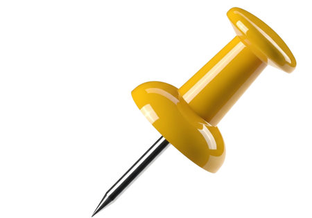 A bright yellow pushpin, a common office and school supply, is presented isolated on a clean white background, highlighting its simple yet functional design.の素材