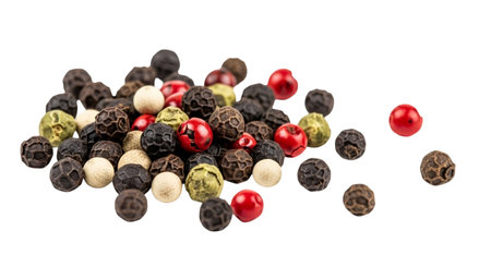 A close-up view of a variety of peppercorns, showcasing their different colors and textures, perfect for culinary and spice-related content.の素材
