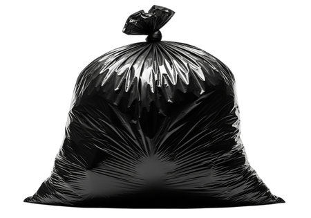 A tightly tied black plastic trash bag sits prominently against a stark white background, conveying a sense of collected refuse ready for disposal.の素材