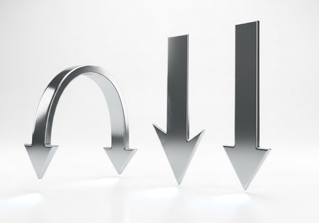 A set of three metallic arrows, with one gracefully curved and two pointing directly downwards, presented cleanly on a white background.の素材