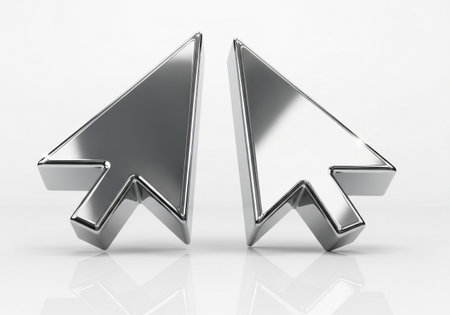 A pair of polished, metallic computer mouse cursor icons, rendered in 3D and positioned to face each other, set against a clean white background.の素材