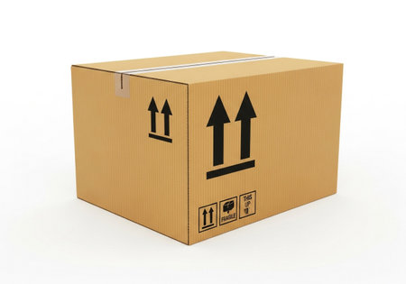 A standard brown cardboard shipping box, clearly marked with 'this side up' arrows and handling symbols. Isolated on a plain white background.の素材