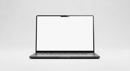 A contemporary laptop is showcased with its screen displaying a pure white void, perfect for showcasing digital content or user interface designs.の素材