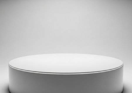 This image features a smooth, white cylindrical podium with a flat top, set against a plain white background, ideal for showcasing items.の素材