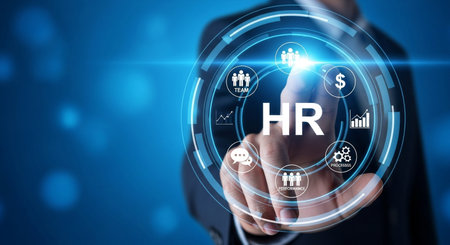 A modern business concept of human resources is displayed, featuring a businessman interacting with a virtual screen showcasing HR-related icons and symbols.の素材