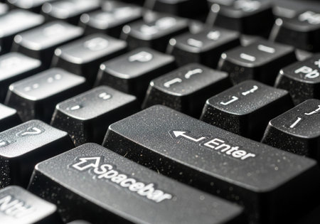 This close-up captures the intricate details of a computer keyboard, highlighting the enter and spacebar keys. The image emphasizes the texture and design of modern technology.の素材