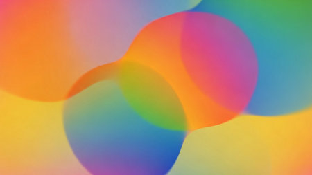 A soft, abstract composition featuring overlapping translucent shapes with a vibrant gradient of colors like orange, yellow, green, blue, and purple.の素材