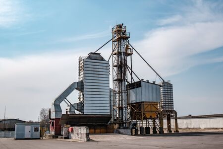 agro-processing and manufacturing plant for processing and silver silos for drying cleaning and storage of agricultural products, flour, cereals and grain. Granary elevator.の写真素材