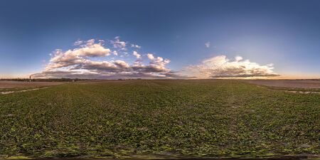 full seamless spherical hdri panorama 360 degrees angle view on among fields in spring evening with awesome clouds in equirectangular projection, ready for VR virtual reality contentの写真素材