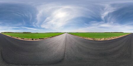 Full spherical seamless panorama 360 degrees angle view on no traffic asphalt road among fields in...